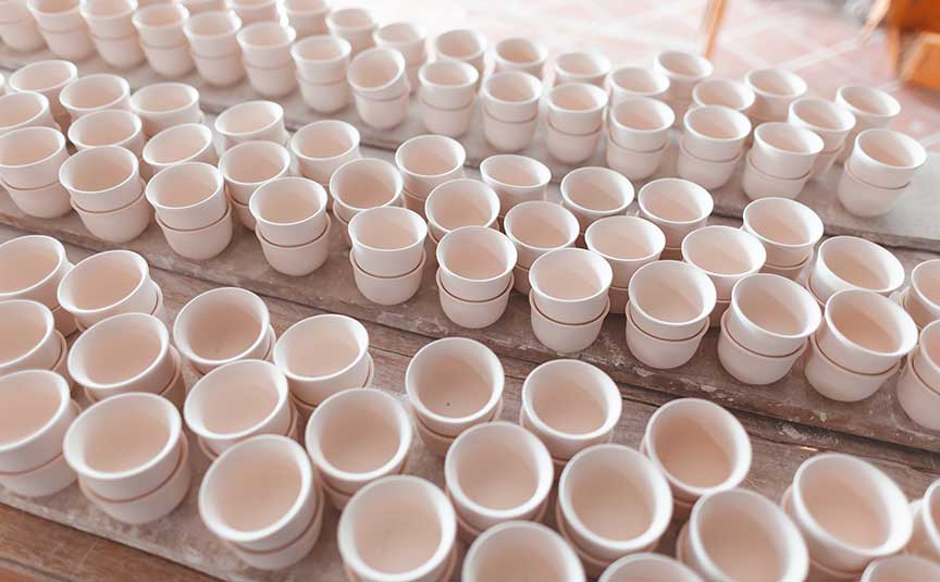 ceramic binder lines of ceramic pots set out to dry