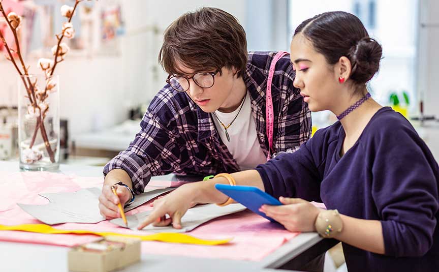 two employees communicating new ideas for the textile industries